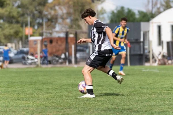 soccer player dribbling